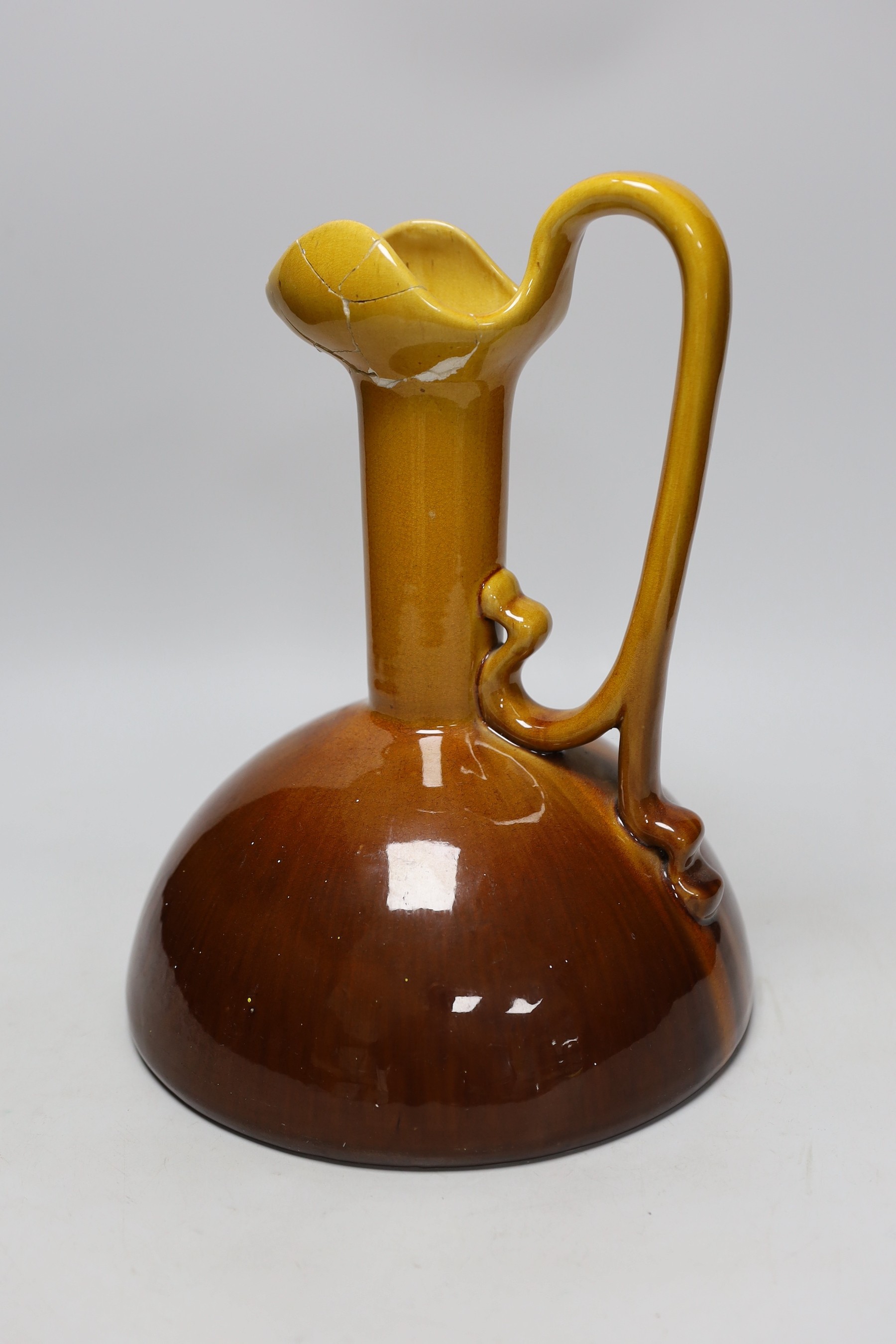 A Bretby ewer in the style of Christopher Dresser, base to top of handle, 31cm high